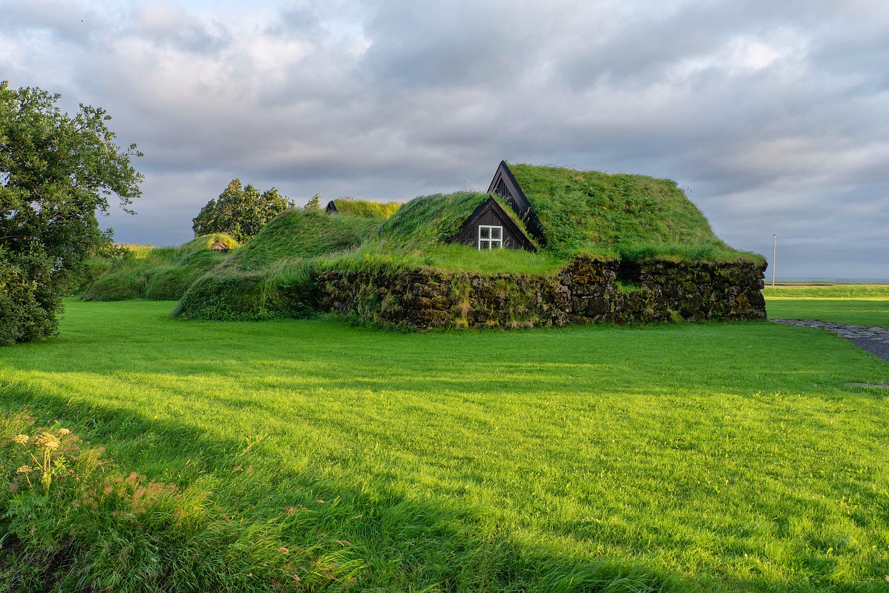 A beautiful view of a house surrounded by green grass