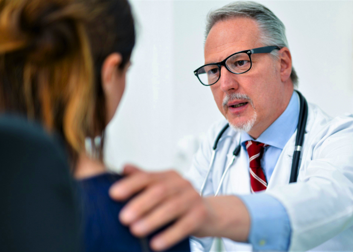 Doctor talking to her female patient