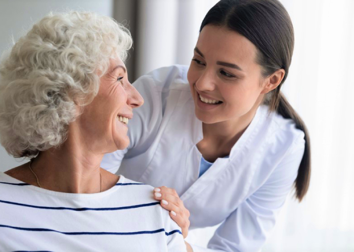 Elderly woman looking at her therapist