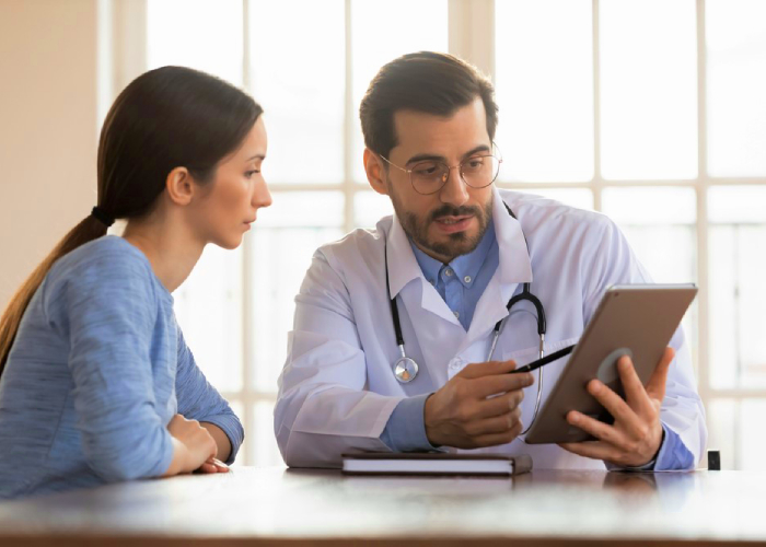 Doctor explaining the medication to her patient