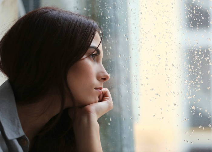 Woman looking outside the window