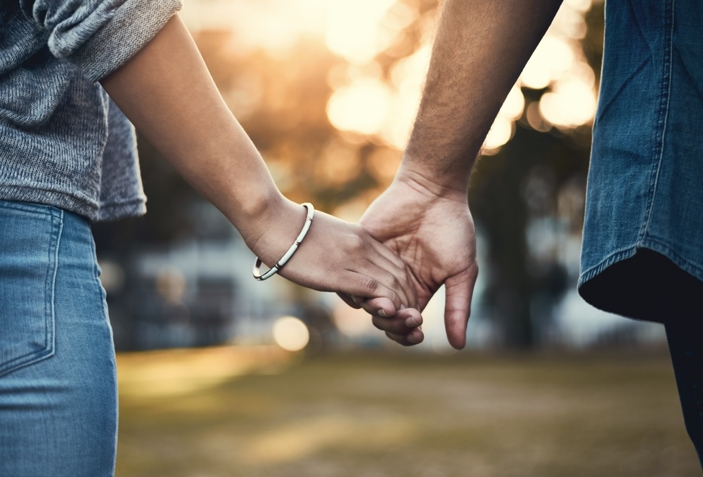 Couple holding hands